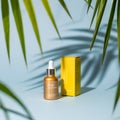 Golden serum bottle and yellow box with palm leaves and blue vactor background dropper bottle Royalty Free Stock Photo