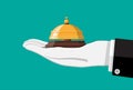 Golden service bell in hand Royalty Free Stock Photo