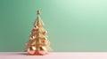 A golden shimmering Christmas tree on a pastel green and pink background.