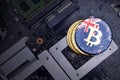 Golden bitcoins with flag of new zealand on a computer electronic circuit board. bitcoin mining concept