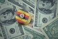 Golden shining bitcoins with flag of uganda on a dollar money background