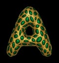 Golden shining metallic 3D with green glass symbol capital letter A - uppercase isolated on black.