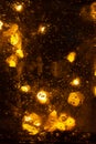 Golden shiny background with bokeh lights. Yellow glittering blurred texture. Lights and bubbles abstract defocused background Royalty Free Stock Photo