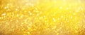 Golden shiny background, copy space for your Christmas greetings. Banner with defocused lights, bright yellow bokeh. Shimmer of Royalty Free Stock Photo