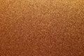 Golden shiny background, yellow sparkles, brown grainy texture. Material pattern, metallic tinsel, decoration
