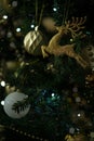 Golden and shiny deer decoration on a christmas tree. Close up. Royalty Free Stock Photo