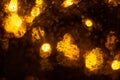 Golden shiny lights bokeh background. Yellow glittering blurred texture. Lights and bubbles abstract defocused background Royalty Free Stock Photo