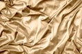 Golden shiny silk fabric texture