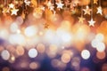 Golden shiny stars on defocused background with bokeh