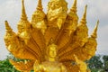 Golden shiny statue of Buddha and dragons in the temple in Phuket. Thailand