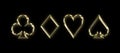 Golden shiny symbols of playing cards on a black background