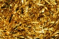 Golden shiny tinsel ribbons. Golden sequins, sparkling stripes of serpentine. Festive decor for new year, birthday