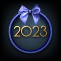 Golden 2023 sign in blue round frame with bow