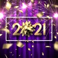 Golden 2021 sign with bow on multicolored background