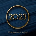 Golden 2023 sign in round frame on blue brush strokes background