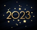 Golden 2023 sign with stars confetti