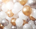 Golden and silver baloons are in the background of a party. Royalty Free Stock Photo