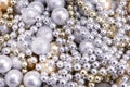 Background of gold and silver beads. Golden silver beads close-up. Royalty Free Stock Photo