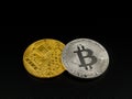 Golden and silver bitcoin on black background. Bitcoin cryptocurrency.