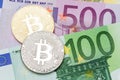 Golden and silver bitcoin Euro background. Bitcoin cryptocurrenc