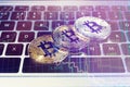 Golden and silver bitcoins on computer keyboard Royalty Free Stock Photo