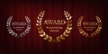 Golden, silver and bronze award signs with laurel wreath isolated on red curtain background. Vector award design Royalty Free Stock Photo