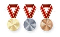 Golden Silver and Bronze medals with laurel hanging on red ribbon. Set of Awards. Award symbol of victory and success. Vector Royalty Free Stock Photo