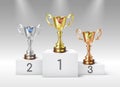 Golden silver bronze trophy cups on award podium. Realistic first second third places winning prizes Royalty Free Stock Photo