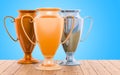 Golden, silver and bronze trophy cups on the wooden table, 3D re