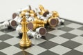 Golden and Silver chess surrounded by a number of fallen chess pieces, business strategy, chess battle, victory, success, teamwork Royalty Free Stock Photo