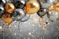 Golden and silver gray metallic glitter balloons and confetti on glistering background. Birthday, holiday or party background. Royalty Free Stock Photo