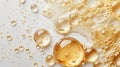 Golden Skincare Oil Drops with Air Bubbles on White Background Royalty Free Stock Photo