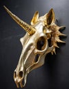 Golden skull of a unicorn hanging on a black wall Royalty Free Stock Photo