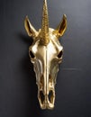 Golden skull of a unicorn hanging on a black wall Royalty Free Stock Photo