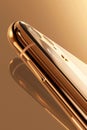 Golden smartphone's display, emphasizing the sleek design and innovative screen technology Royalty Free Stock Photo