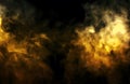 Golden smoke with black background. Royalty Free Stock Photo