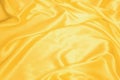 Golden smooth satin or silk texture background. Elegant cloth material textiles. White fabric abstract texture. Luxury satin