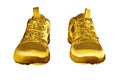 Golden sneakers white background isolated closeup, gold metal sport shoes, luxury running gumshoes, yellow metallic fitness boots