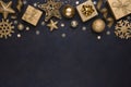 Golden snowflakes, gifts, christmas balls and stars on dark background Royalty Free Stock Photo