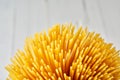 Golden spaghetti bundle close up with copy space Royalty Free Stock Photo