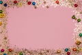 Golden sparkle glittering Christmas frame, pink background, top view