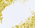 Golden sparkle glittering frame. Golden glitter sand texture frame on white, abstract background with copy space. Royalty Free Stock Photo