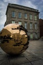 Golden sphere in the trinity college campus in dublin Royalty Free Stock Photo