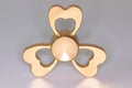 Golden spinner stress relieving toy on white background