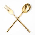 golden spoon and fork isolated on a white