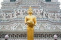 Golden standing Buddha at main Prang of Wat Arun Ratchawararam Ratworamahawihan Temple of Dawn . Royalty Free Stock Photo