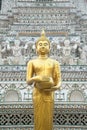 Golden standing Buddha at main Prang of Wat Arun Ratchawararam Ratworamahawihan Temple of Dawn . Royalty Free Stock Photo