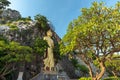 Golden standing buddha statue on the cliff at Khao Hin Ngoo Moutain Rock Park Snake mountain, Ratchaburi province, Thailand.