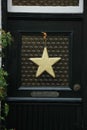 Golden star on glass door Royalty Free Stock Photo