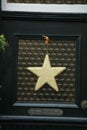 Golden star on glass door Royalty Free Stock Photo